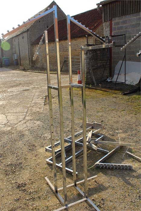 Two sets of chrome clothes rails of square form plus parts.