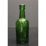 A green glass bottle of local interest "Lowe, Son & Cubbold LTD" - Stamford 1443 in relief to
