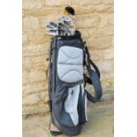 Golf clubs, twelve irons including Taylor LXS in golf bag.