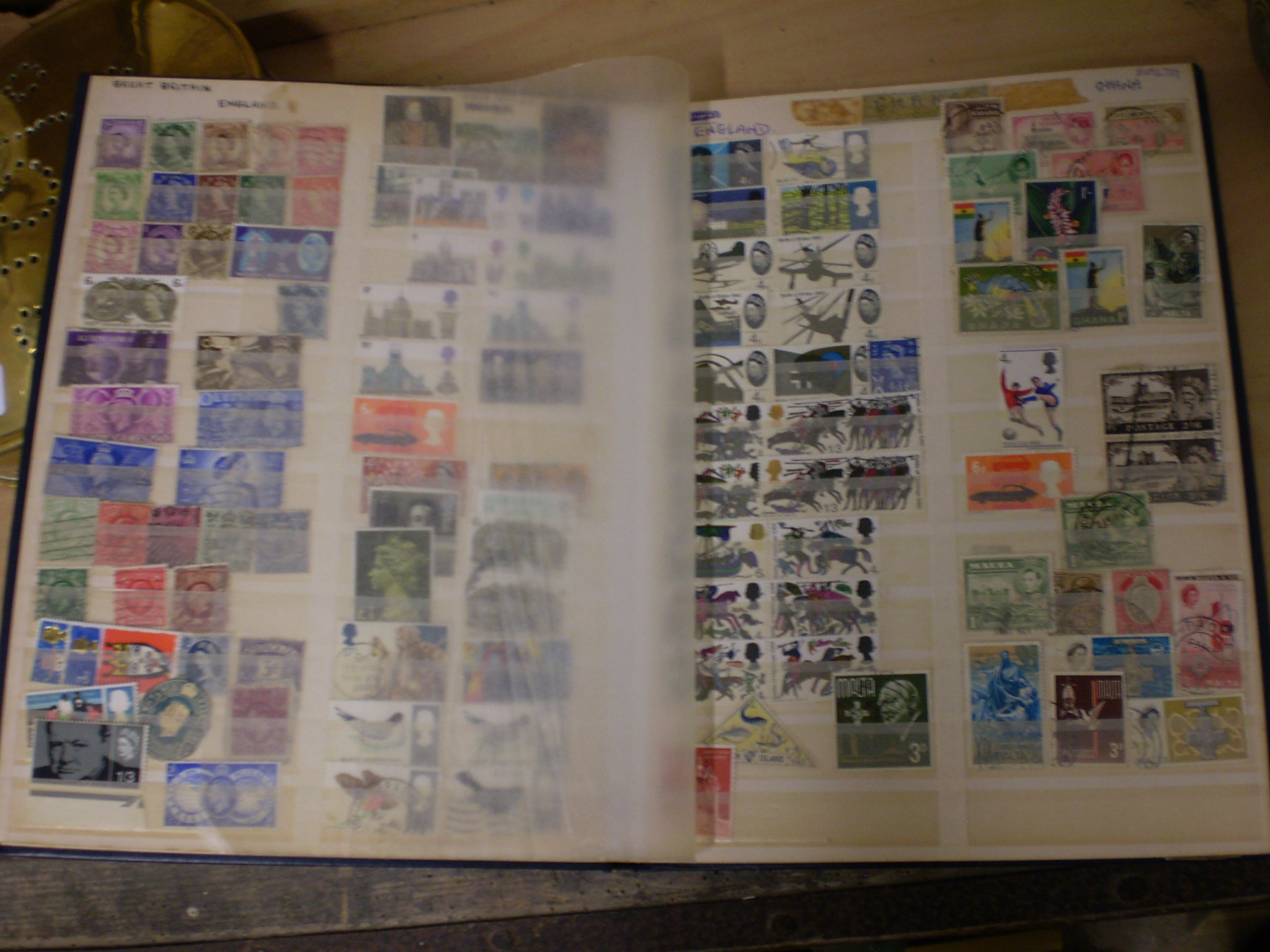 STAMP ALBUM CONTAINING HUNDREDS OF VARIOUS STAMPS