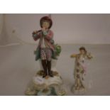 2 FIGURINES, ONE FLUTE PLAYER AND A LADY,