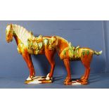 Pair graduated Chinese ceramic Tang style horses.