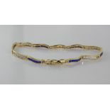 14ct yellow gold bracelet with blue gemstones