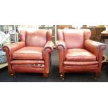 Pair of leather wingback armchairs