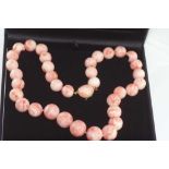 Good boxed pink coral graduated bead necklace