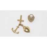 Gold heart lock and small charms all marked 375