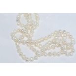 Long strand of white pearls