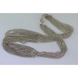 Twelve strand sterling silver beaded necklace