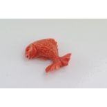 Unset carved Italian red coral fish charm