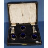 Cased Edwardian sterling silver condiment set