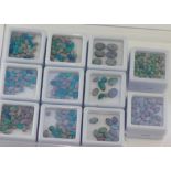 Eleven boxes of various size opal doublets