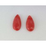 Two good unset pear shaped coral pieces