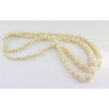 Graduated double-strand carved bone necklace