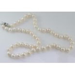 White pearl necklace with 14K plated clasp
