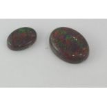 Two unset solid opals