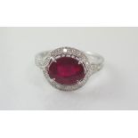 18ct white gold, oval ruby and diamond ring