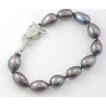 Black baroque pearl bracelet with leopard clasp