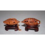 Two finely carved nuts in the form of river boats