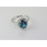 Silver and blue topaz ring