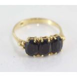 9ct yellow gold and dark blue sapphire ring