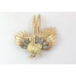 A gold & diamond cocktail bird of paradise brooch,