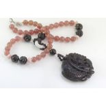 Jade &peach quartz necklace with onyx fish pendant