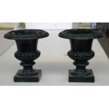 Pair of small cast iron garden urns