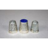 Three assorted sterling silver thimbles