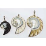 Three silver shell pendants