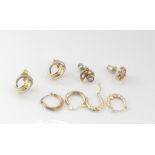 Four small pairs of gold earrings