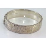 Hallmarked hinged silver engraved bangle