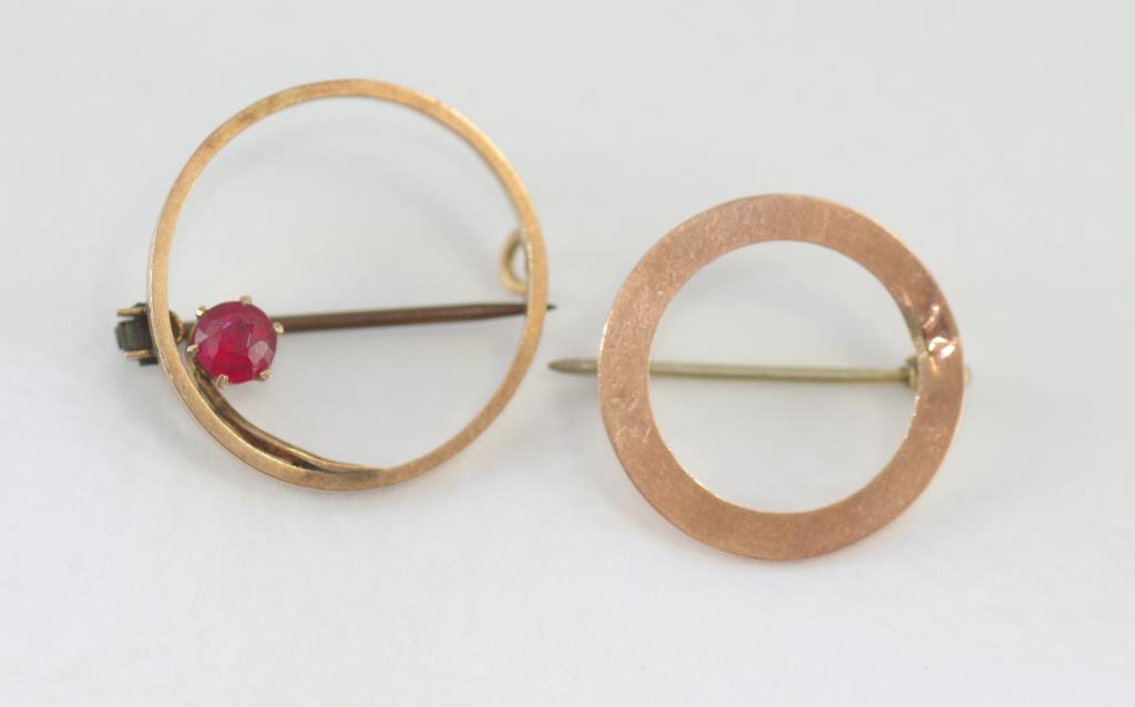 Two 9ct rose gold circular brooch