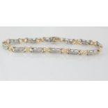 Two tone 14ct gold bracelet with baguette diamonds