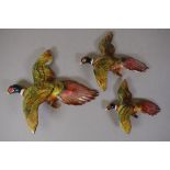 Three vintage flying duck wall figurines