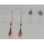 Two pairs of small gold earrings