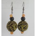 Carved dragon ball earrings