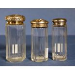 Three Edwardian sterling silver topped toilet jars