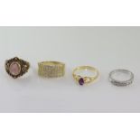Four various costume rings