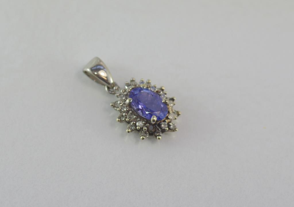 9ct white gold, mauve gem and diamond pendant