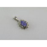 9ct white gold, mauve gem and diamond pendant