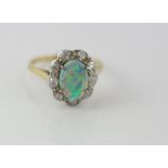 18ct yellow gold, black opal double & diamond ring