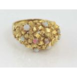 Unusual yellow gold and solid opal ring marked 18K