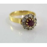 18ct yellow gold, ruby and diamond cluster ring