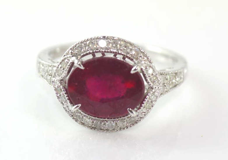 18ct white gold, oval ruby and diamond ring