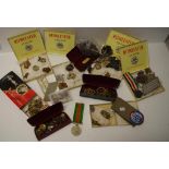 Collection of military medals, badges, buttons,