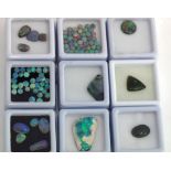 Nine boxes of loose opals