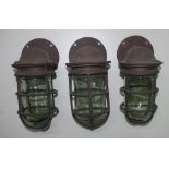 Three brass bulkhead lights