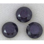 Three loose black round brilliant cut diamonds