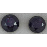 Two loose black round brilliant cut diamonds