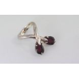 Unusual silver and garnet wrap-over ring